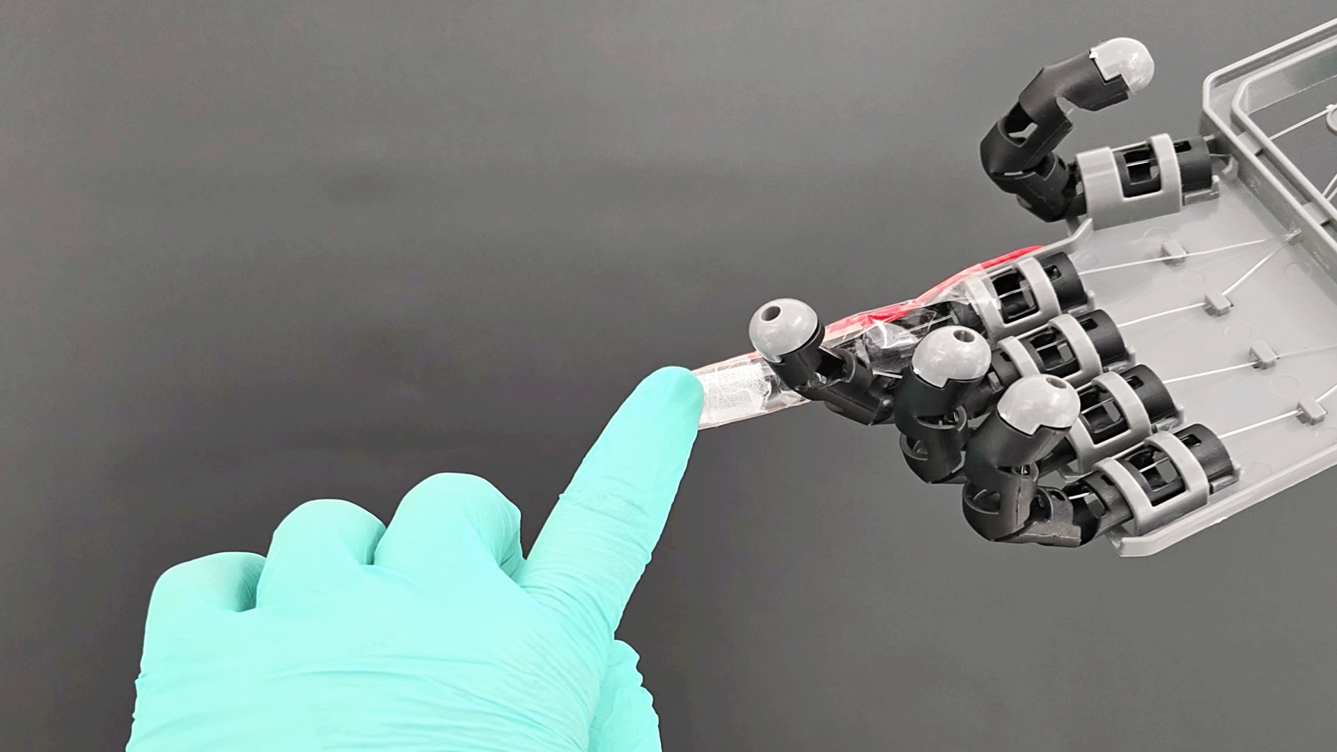 Stretchable electronic skin lets robotic hand feel touch and pressure signals