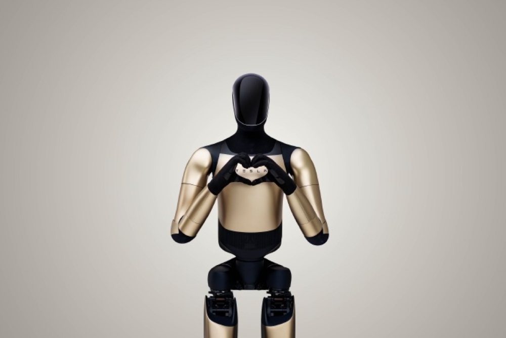 Elon Musk's Promises Fulfilled? Tesla's Humanoid Robot Makes a Heart Gesture, Sparking Excitement