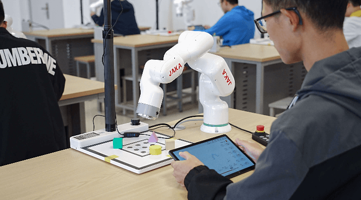 How a Small Robotic Arm Reduces Footprint in Electronics Benchtop Assembly