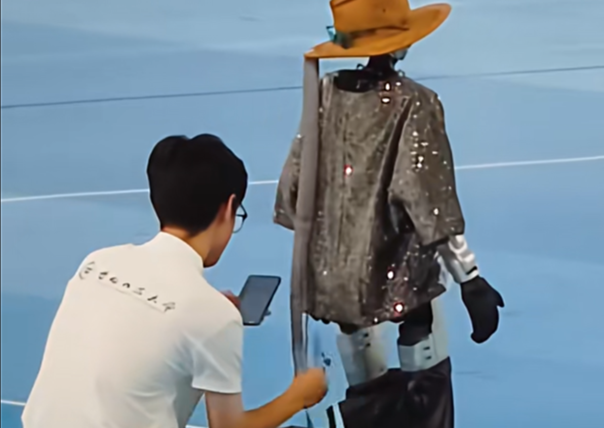Robot's Intense Dance Performance Leads to Public Wardrobe Malfunction at WAIC 2026